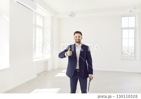 Happy Real Estate Agent Giving Thumbs Up In New Home Or Office Happy Real Estate Agent Giving Thumbs Up In New Home Or Office 130110328