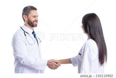 hospital teamwork collaboration. successful treatment. doctor handshake with nurse. two doctor shaking hands isolated on white. Handshake, agreement on patient health. Handshake etiquette 130110982