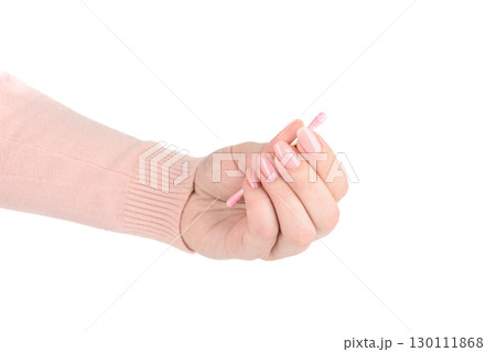 Pink cotton swab in fingers of young woman against white background. Pink cotton swab in fingers of young woman against white background. 130111868