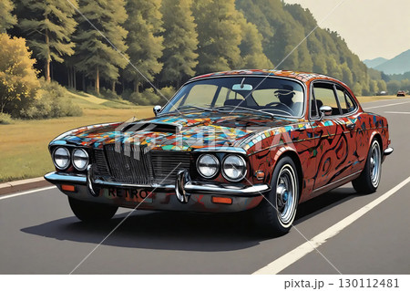 Classic retro car driving on road with trees and landscape. A classic retro car with a vibrant, multicolored paint design is driving on a road flanked by lush green trees. 130112481