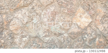 Photo of a stone wall high res. Natural cobblestone wall as background. 130112498