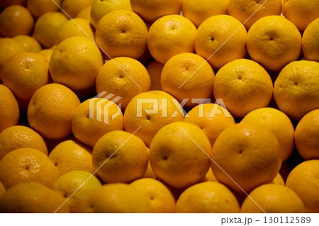 Delightful and Vibrant Display of Fresh Oranges in the Local Market for all to enjoy Delightful and Vibrant Display of Fresh Oranges in the Local Market for all to enjoy 130112589
