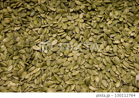 A CloseUp View of Green Pumpkin Seeds Ideal for Enjoying Healthy Snacking Options 130112764