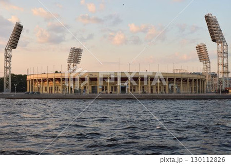 Experience a beautiful and scenic view of a stunning stadium located by the waters edge 130112826
