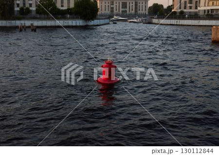 A Bright Red Fire Hydrant Nestled Among Bountiful Water Sources, Creating a Striking Scene A Bright Red Fire Hydrant Nestled Among Bountiful Water Sources, Creating a Striking Scene 130112844