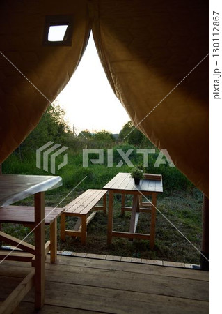 Enjoy a cozy glamping experience with outdoor seating and a stunning scenic view Enjoy a cozy glamping experience with outdoor seating and a stunning scenic view 130112867