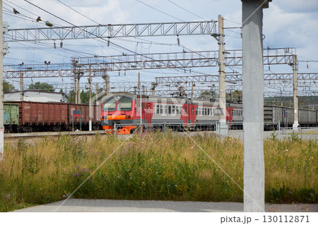 A Colorful Train is Currently Passing Through a Quiet and Peaceful Railway Station A Colorful Train is Currently Passing Through a Quiet and Peaceful Railway Station 130112871