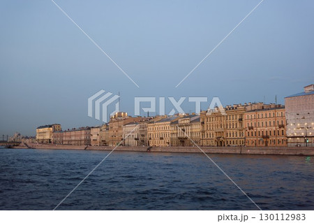 A Scenic Riverfront View Showcasing Beautiful Historic Buildings and Surrounding Nature 130112983