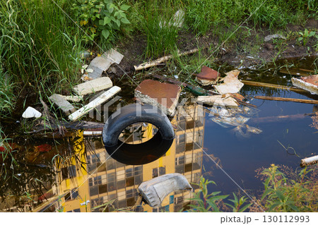 Abandoned Location Filled with Waste and Reflection of Our Communitys Environment Abandoned Location Filled with Waste and Reflection of Our Communitys Environment 130112993