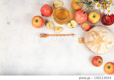 Autumn composition with apples, honey, pomegranate and flowers. Harvest concept and hello autumn, jewish new year rosh hashanah, eco food. Healthy food, body detox, selective focus, space for text Autumn composition with apples, honey, pomegranate and flowers. Harvest concept and hello autumn, jewish new year rosh hashanah, eco food. Healthy food, body detox, selective focus, space for text 130113054