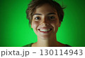 A cheerful face illuminated by soft lighting emphasizing community spirit 130114943