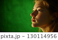 Soft lighting illuminates the subjects face creating a warm and inviting aura 130114956