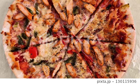 Enjoy the flavor of a Delicious Chicken Pizza topped with Fresh Vegetables and herbs 130115936