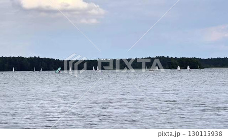 Sail serene lakes and oceans, enjoying natures beauty, leisure, and scenic landscapes Sail serene lakes and oceans, enjoying natures beauty, leisure, and scenic landscapes 130115938