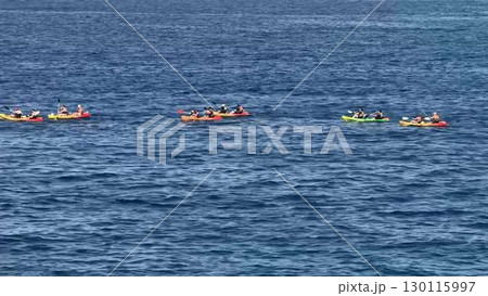 Embark on a thrilling kayaking adventure amidst the clear, vivid waters of natures beauty Embark on a thrilling kayaking adventure amidst the clear, vivid waters of natures beauty 130115997