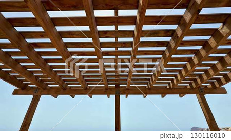 A Beautiful, Scenic Wooden Pergola That Offers a Stunning Overlook of the Seaside View A Beautiful, Scenic Wooden Pergola That Offers a Stunning Overlook of the Seaside View 130116010