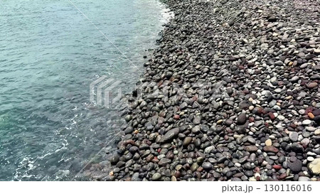 A stunning Rocky Beach with calm waves and clear water, ideal for relaxation and exploration 130116016