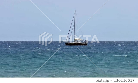 Sailing on a boat over the serene and tranquil waters of the vast ocean brings true peace and joy 130116017