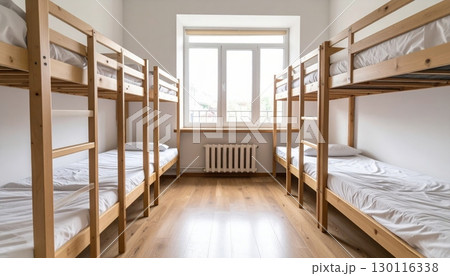 Luxurious hotel bedroom interior with a comfortable bed, elegant furniture, and a large window 130116338