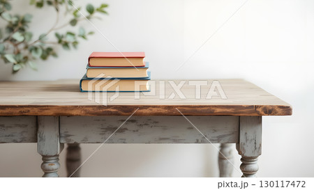 アンテイークの古びたテーブルに置かれた3冊の本のイラスト アンテイークの古びたテーブルに置かれた3冊の本のイラスト 130117472