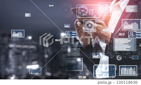Businessman in Suit Holding Tablet Surrounded by Digital Data and Graphs Representing Modern Technology and Financial Analysis in Urban Setting xenic Businessman in Suit Holding Tablet Surrounded by Digital Data and Graphs Representing Modern Technology and Financial Analysis in Urban Setting xenic 130118630