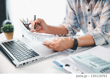 Businesswoman analysis with financial data, marketing business strategy project, Business financing accounting banking concept, finances, calculate about cost to real estate investment, tax system. 130118761