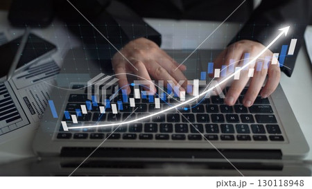 Business analytics and financial growth concept depicting hands on laptop keyboard with rising graph trends and stock market analysis representation. Copula Business analytics and financial growth concept depicting hands on laptop keyboard with rising graph trends and stock market analysis representation. Copula 130118948