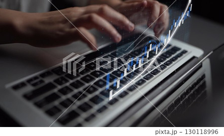 Hands Typing on Laptop Keyboard with Digital Graph Overlay Indicating Data Analysis and Growth in Technology for Business Success and Finance Trends Copula Hands Typing on Laptop Keyboard with Digital Graph Overlay Indicating Data Analysis and Growth in Technology for Business Success and Finance Trends Copula 130118996