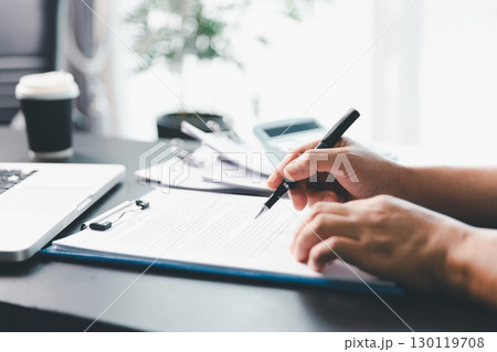 Business person with contract law and paper work for business finance, loan application form, contract real estate and insurance concept. signing contract, working on desk, business document 130119708