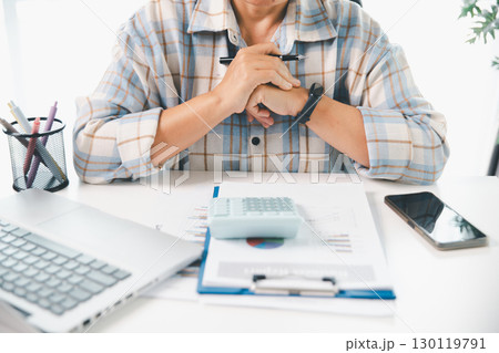 Businesswoman analysis with financial data, marketing business strategy project, Business financing accounting banking concept, finances, calculate about cost to real estate investment, tax system. 130119791