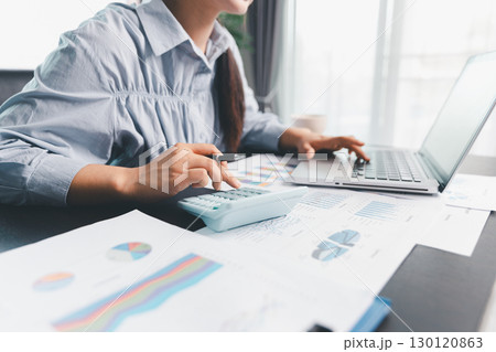 Business woman analyze calculate company financial, tax results office accounting statistics analytical research. calculating business balance prepare tax reduction. Tax deduction planning concept. Business woman analyze calculate company financial, tax results office accounting statistics analytical research. calculating business balance prepare tax reduction. Tax deduction planning concept. 130120863