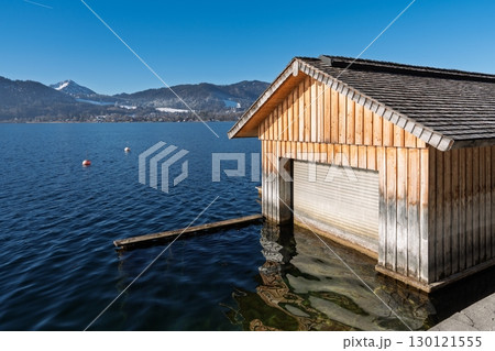 Picturesque Boathouse on Lake Tegernsee, Bavaria, Germany A Serene Waterscape View Picturesque Boathouse on Lake Tegernsee, Bavaria, Germany A Serene Waterscape View 130121555