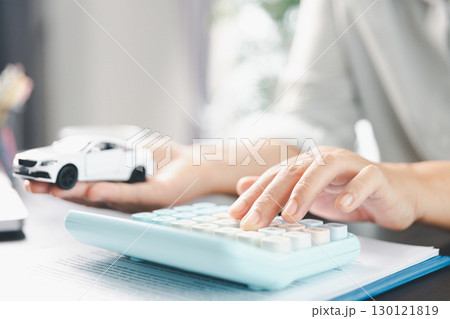 Sale agent deal to agreement successful car loan contract with customer and sign agreement contract Insurance car concept. Car dealer businesswoman signing car insurance document or lease paper. 130121819