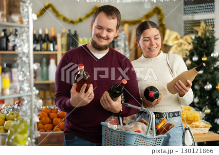 Married couple chooses alcohol in a store with interest 130121866
