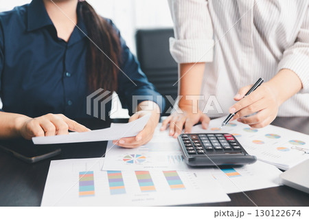 Business meeting, data analytics or women with graph presentation in office. Chart, analysis accounting team brainstorming economy, inflation or solution. business project finance investment concept. 130122674
