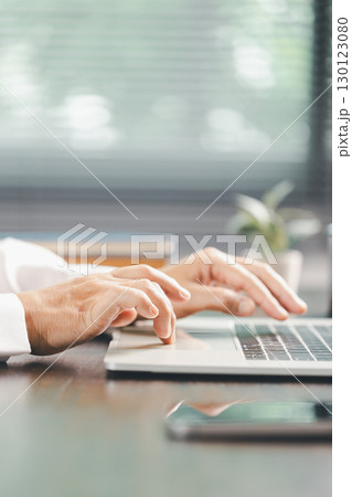 Finance bank tax expense accounting budget money businessman hand use calculator Financial calculate accountant close up calculator with graph chart write office desk Business expense analysis saving 130123080