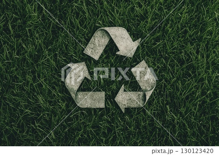 Eco-Friendly Recycling Icon on Grass Background 130123420
