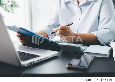 Business person with contract law and paper work for business finance, loan application form, contract real estate and insurance concept. signing contract, working on desk, business document 130123516