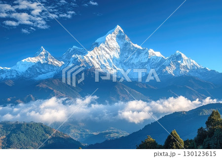 Scenic Snow-Capped Mountain Range with Fluffy Clouds 130123615