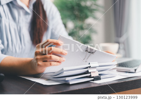 Business woman analyze calculate company financial, tax results office accounting statistics analytical research. calculating business balance prepare tax reduction. Tax deduction planning concept. 130123999