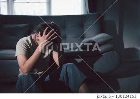 Despair sorrow person in empty dark room, Depressed young woman covering face with hands. Young woman coping with distress covering face. mental health concept. Boring sad upset frustrated stressed. Despair sorrow person in empty dark room, Depressed young woman covering face with hands. Young woman coping with distress covering face. mental health concept. Boring sad upset frustrated stressed. 130124153