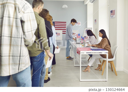American voters standing in line at the polling station during the election in the USA American voters standing in line at the polling station during the election in the USA 130124664