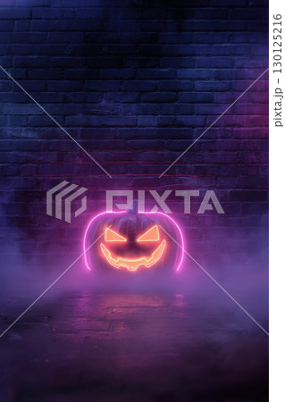 Neon Jack-o'-lantern Graffiti Glowing on Brick Wall with Misty Purple and Orange Light 130125216