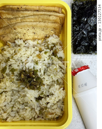 A traditional Korean dosirak, beautifully arranged with rice, assorted banchan, and savory proteins. Balanced and visually inviting, its a portable meal packed with vibrant flavors. 130127534