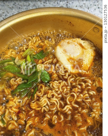 Shin Ramyun,close up of Ramyeon or Ramyun is a Korean-style soup noodle dish with a spicy flavor. Ramyeon or Korean instant noodles with egg - Korean food style 130127536