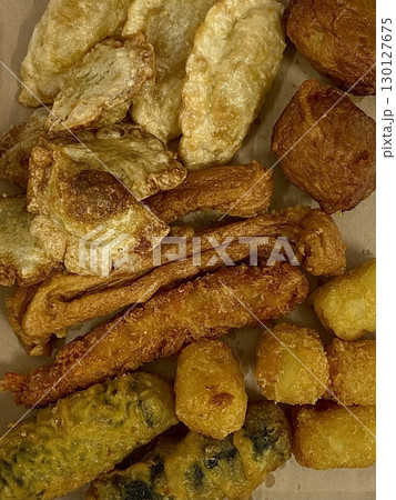 A classic combination of a juicy burger with fresh toppings served alongside golden, crispy French fries. Perfect for a satisfying meal that blends savory flavors and crunchy textures. 130127675