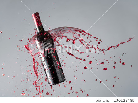 Bottle of red wine and splashes. 130128489