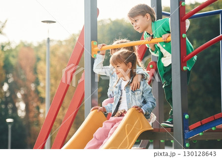 On the playground. Kids are having fun together 130128643