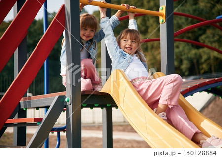 On the playground slide. Kids are having fun 130128884