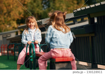 Children are active, smiling. Kids are having fun on the playground 130128911